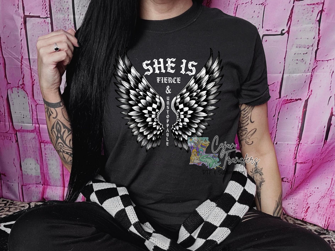 a woman with long black hair wearing a black shirt