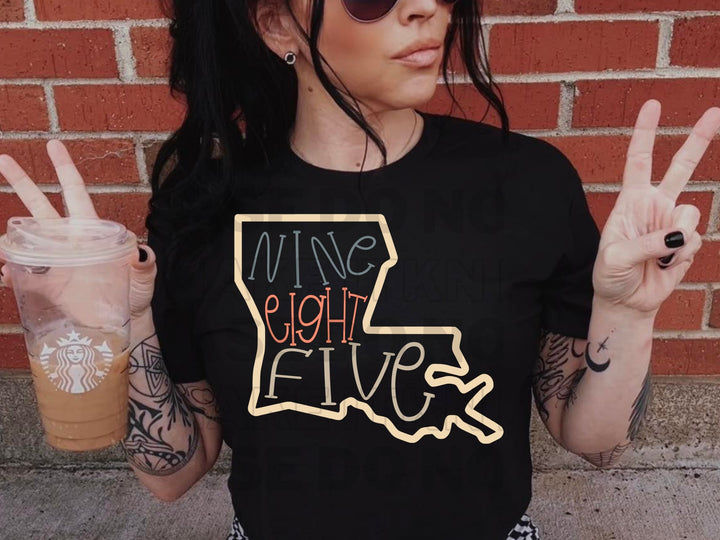 a woman wearing a black shirt holding up two fingers
