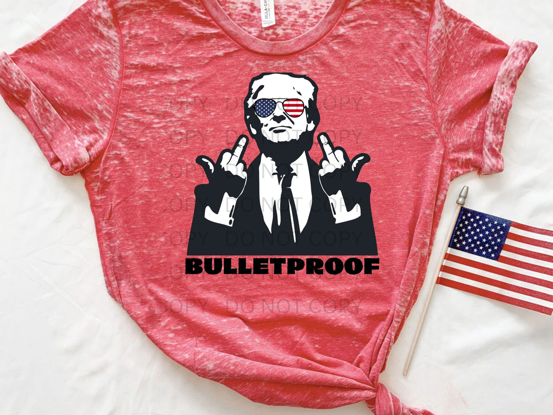 a red shirt with a picture of a man in a suit and sunglasses