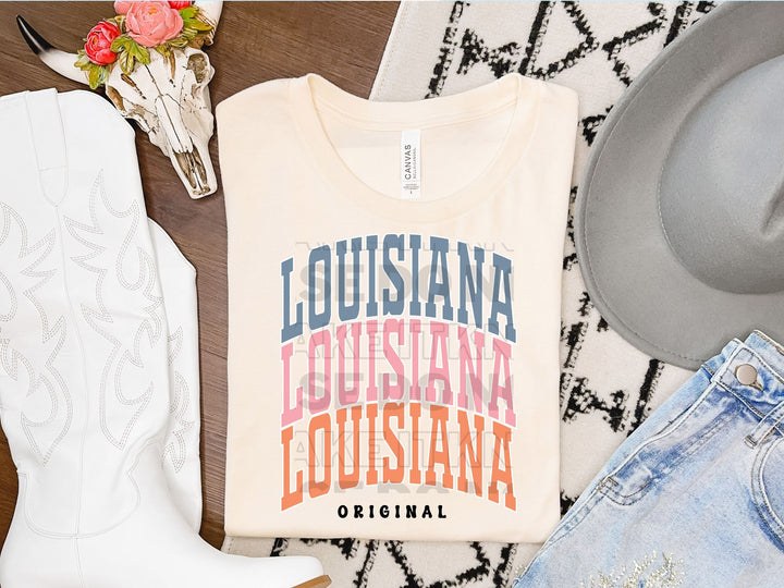 a pair of cowboy boots, a t - shirt, and a pair of jeans