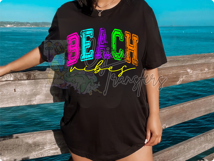 a woman wearing a black beach life shirt