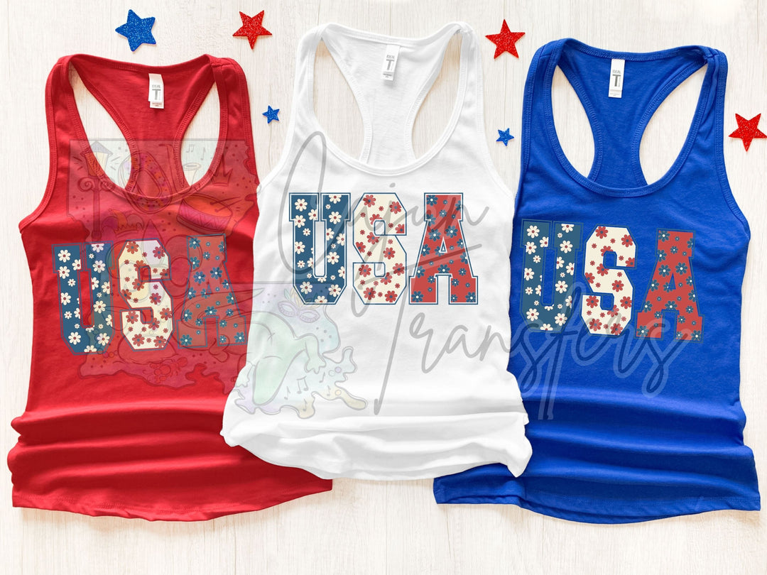 three women's tank tops with the word usa printed on them