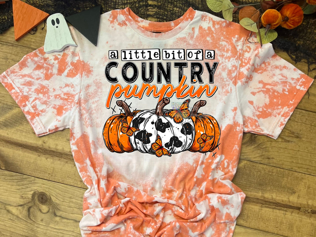 an orange and white shirt with a cow and pumpkin on it