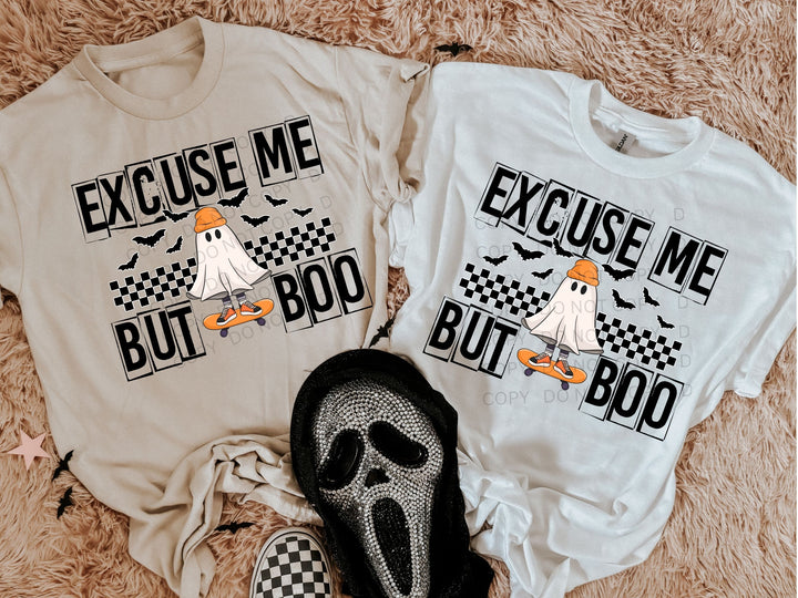 a couple of t - shirts that are on a bed