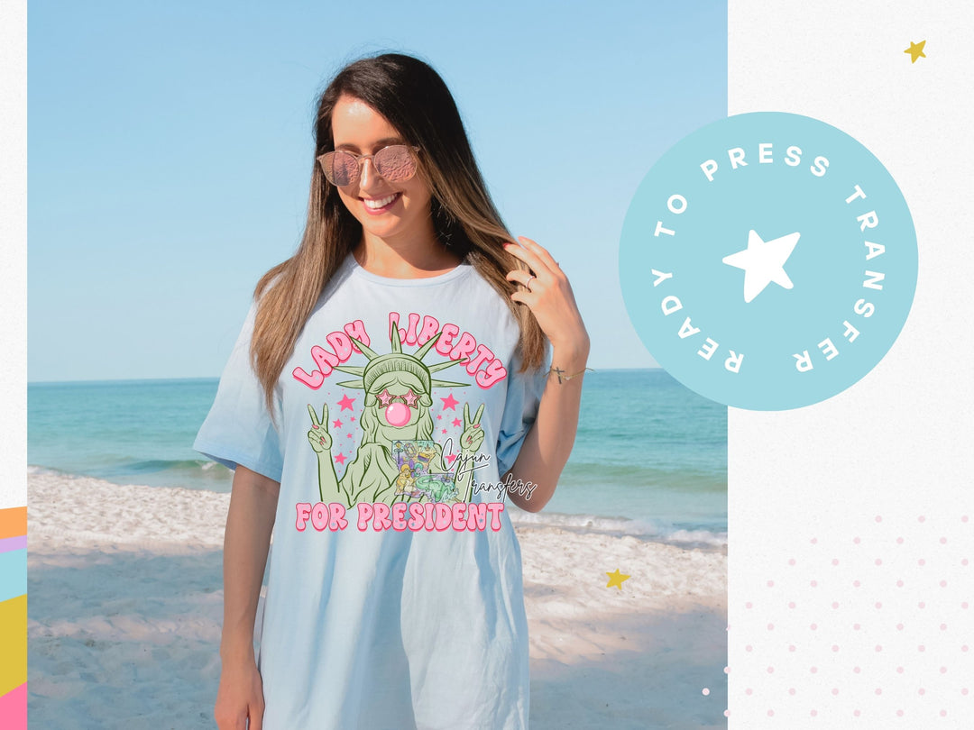 a woman standing on a beach next to the ocean
