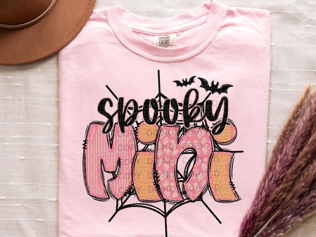 a pink t - shirt with the word boo on it