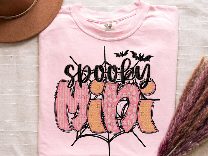 a pink t - shirt with the word boo on it