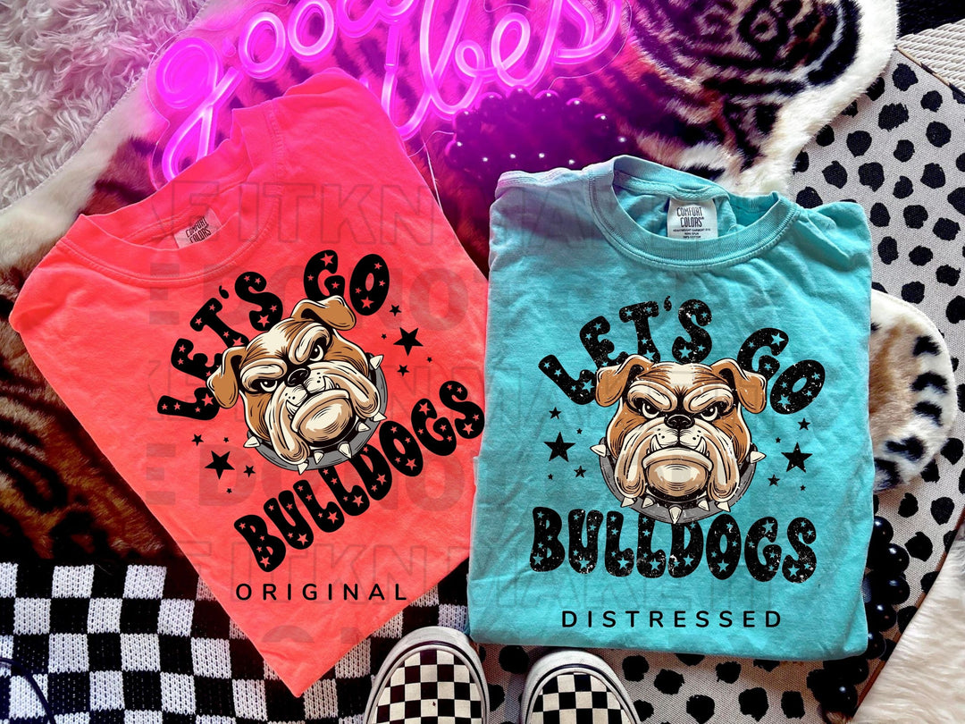 a couple of shirts that are on a bed