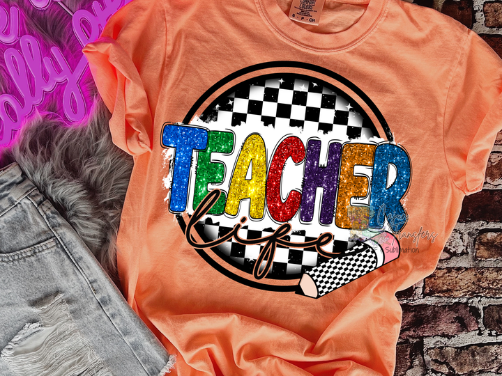 an orange shirt with the words teacher on it