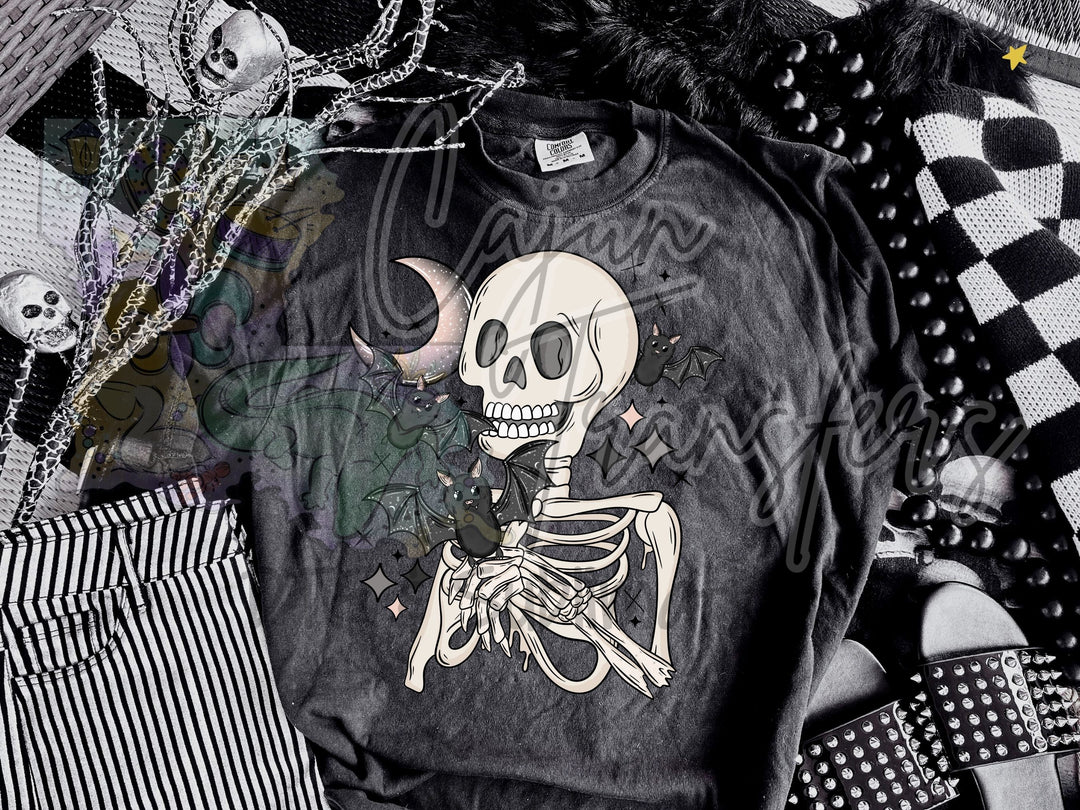a black shirt with a skeleton on it
