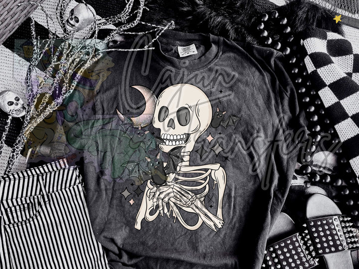 a black shirt with a skeleton on it