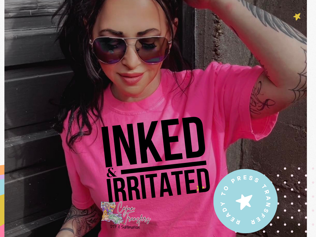 a woman wearing a pink shirt with inked and irritated on it