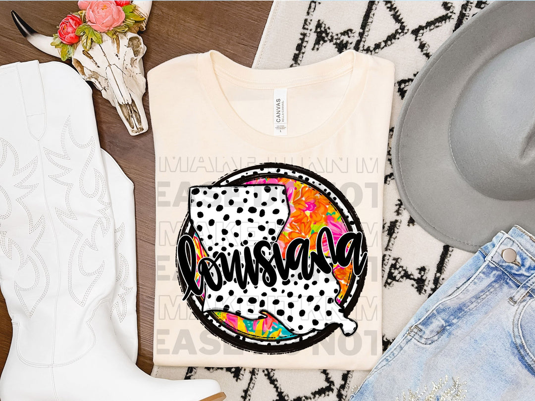 a pair of cowboy boots, a t - shirt, and a pair of jeans