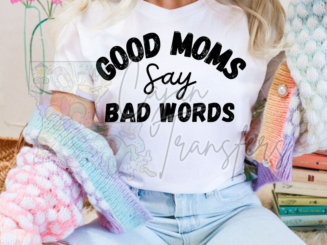 a woman wearing a t - shirt that says, good moms say bad words