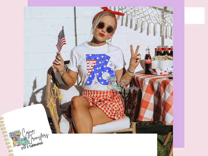 a woman sitting in a chair with a flag on her shirt