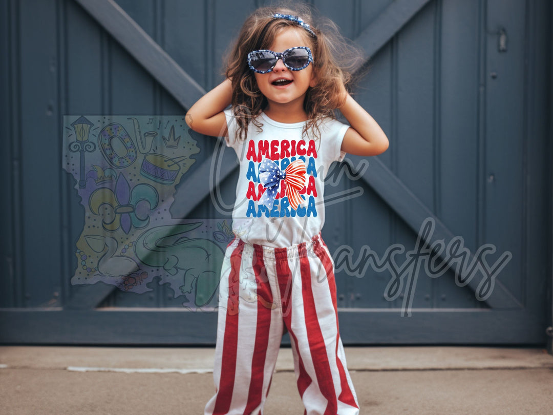 a little girl wearing patriotic clothing and sunglasses
