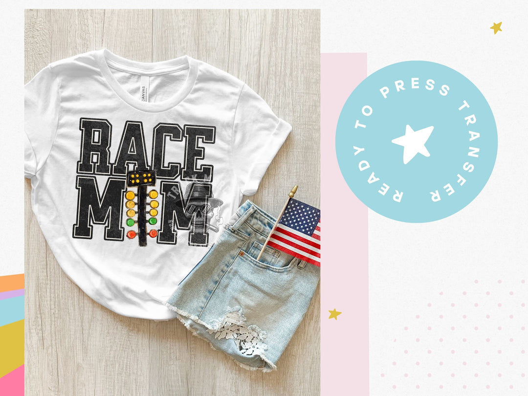 a t - shirt with the words race mom on it next to a pair of