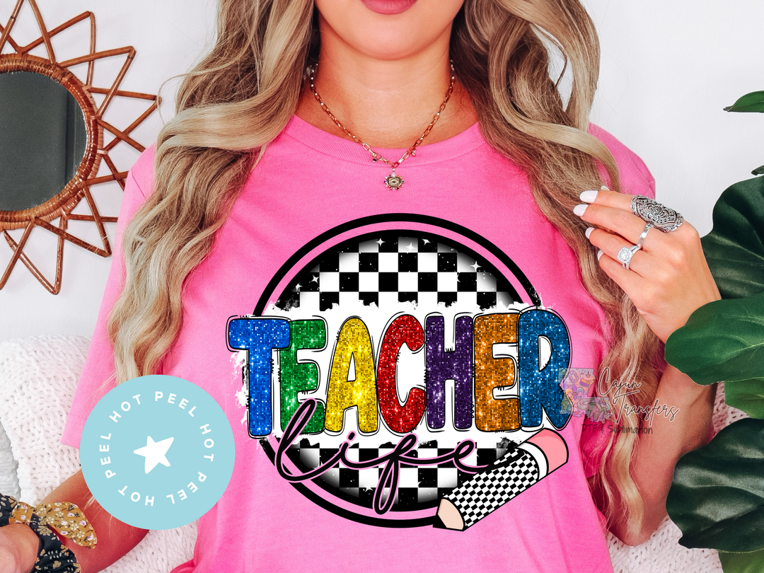 a woman wearing a pink teacher tshirt