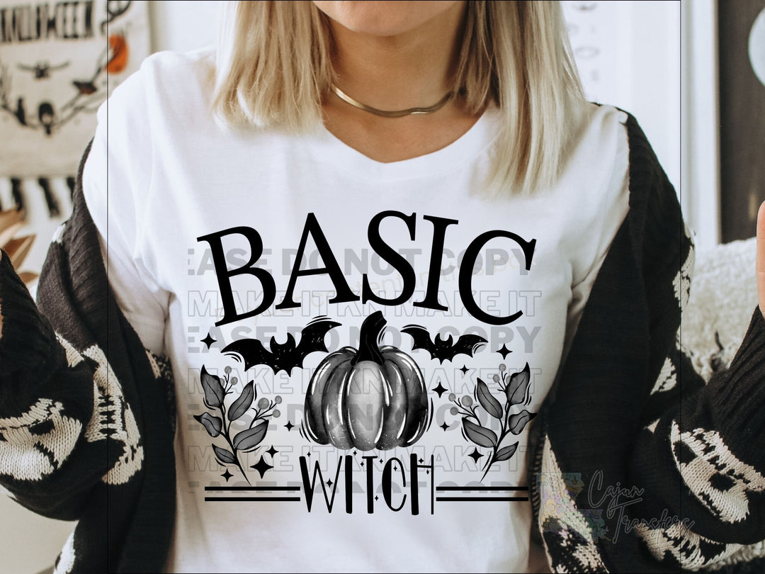 a woman wearing a t - shirt that says basic witch