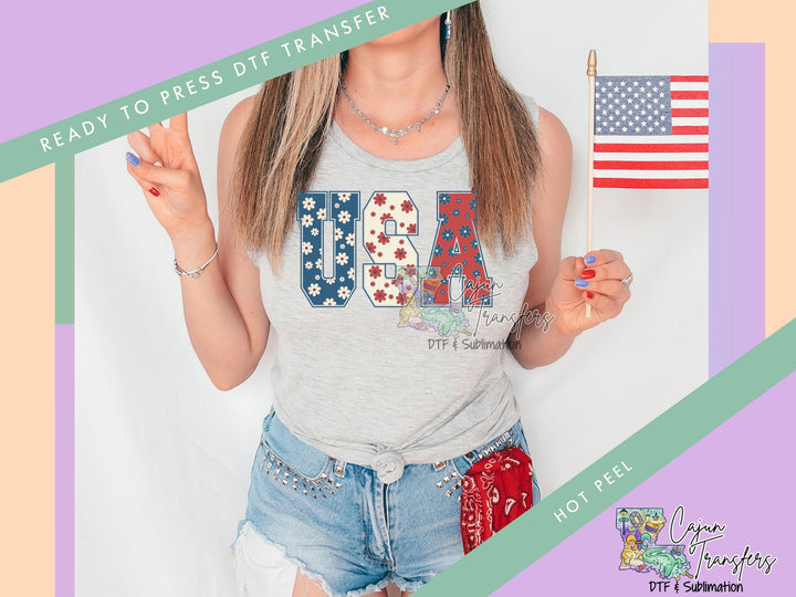 a woman holding a small american flag on a stick