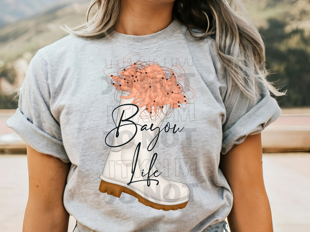 a woman wearing a t - shirt with a picture of a tree on it