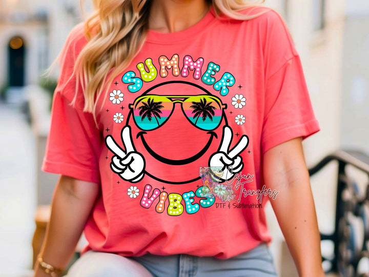 a woman wearing a pink shirt with a smiley face on it