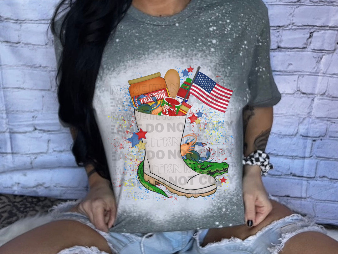 a woman sitting on a bed holding up a t - shirt