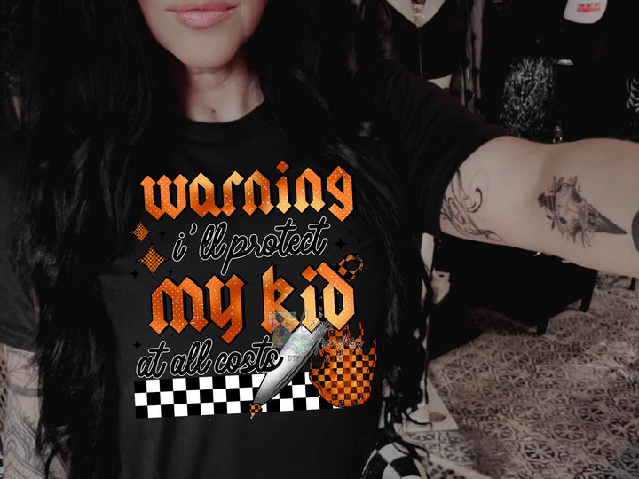 a woman wearing a black shirt with a checkered design
