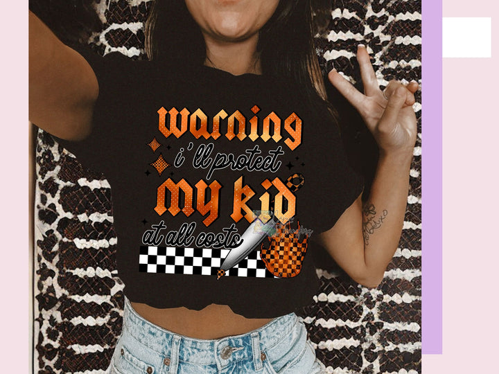 a woman wearing a black shirt with a checkered design