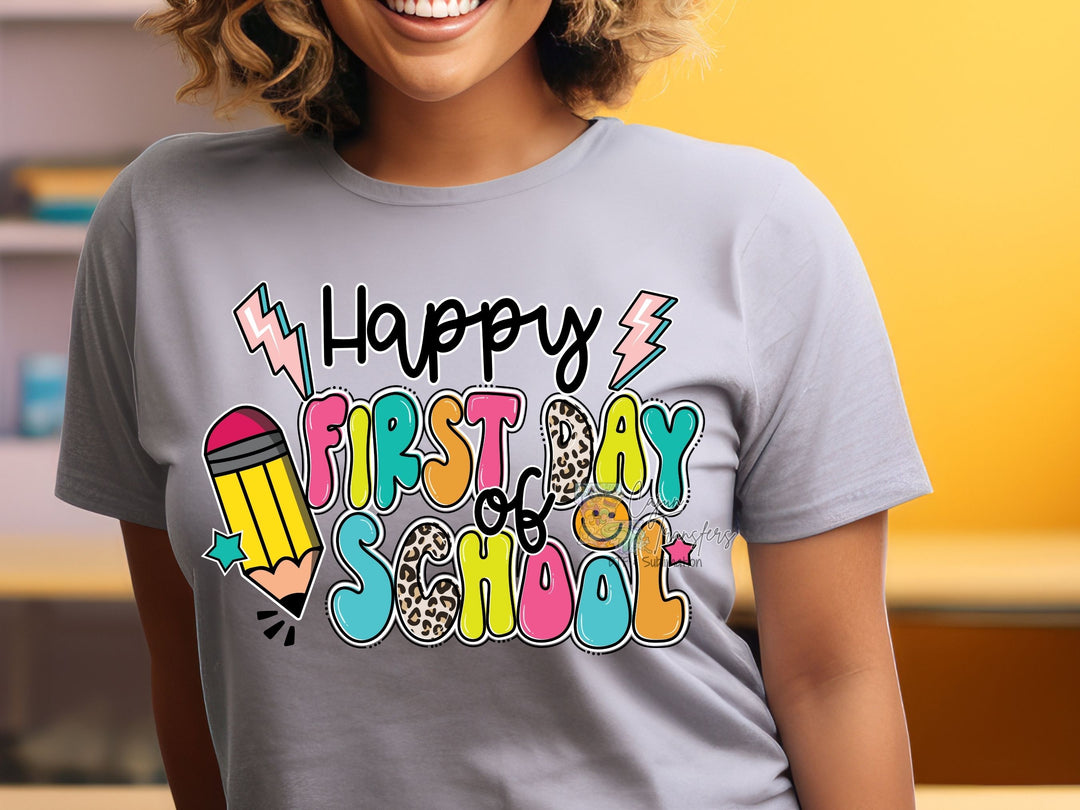 a woman wearing a happy first day school shirt