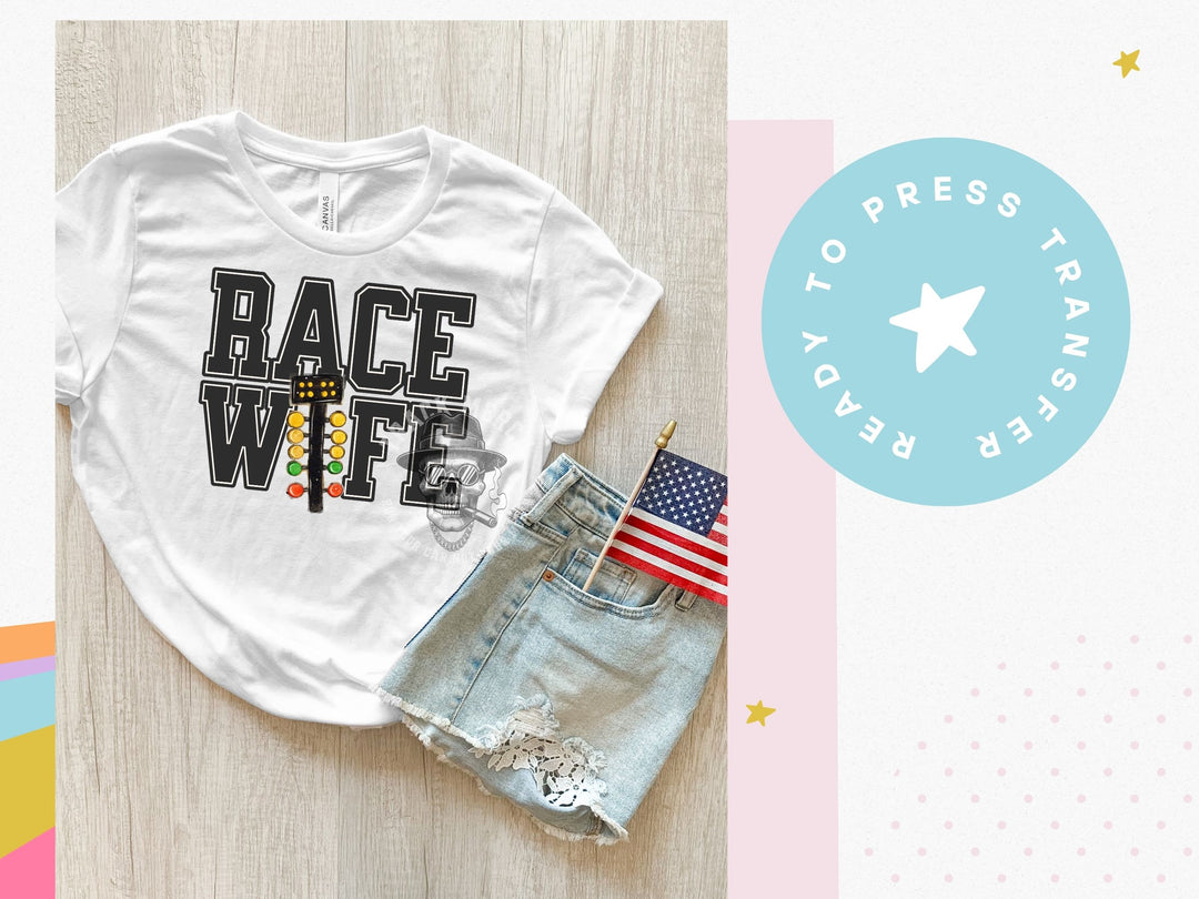 a t - shirt with the words race wife on it next to a pair of