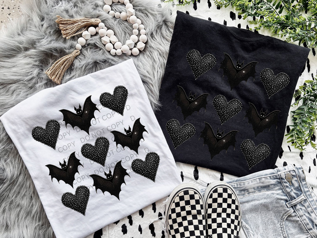 a pair of shoes and a t - shirt with bats on them