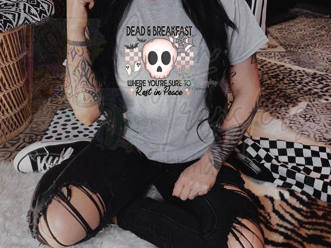 a woman sitting on a bed with a tattoo on her arm