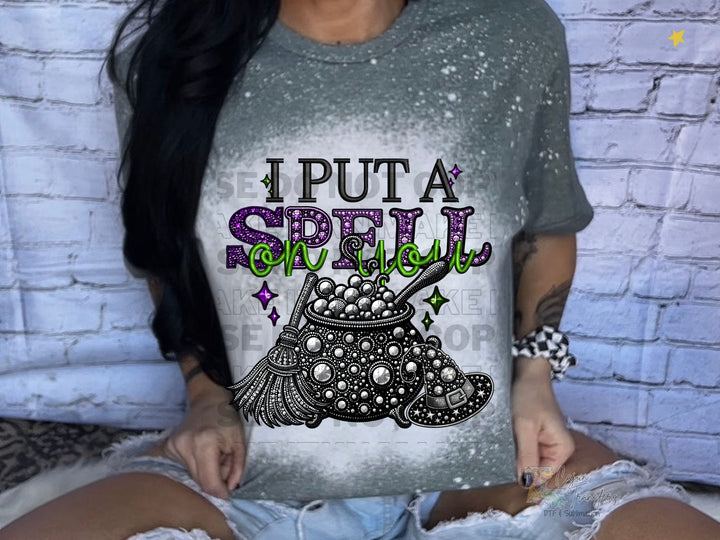 a woman wearing a t - shirt that says i put a spell on it