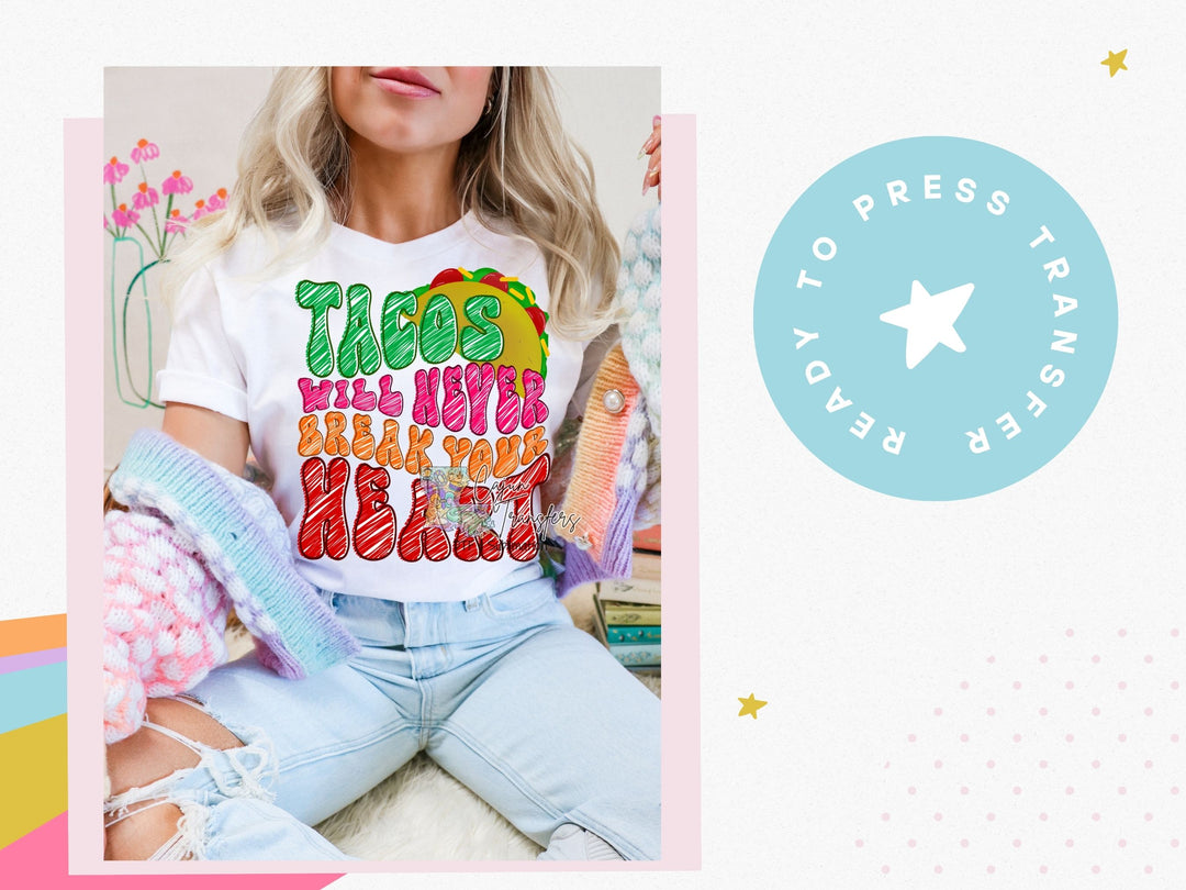 a woman wearing a t - shirt that says tacos with my heart on it