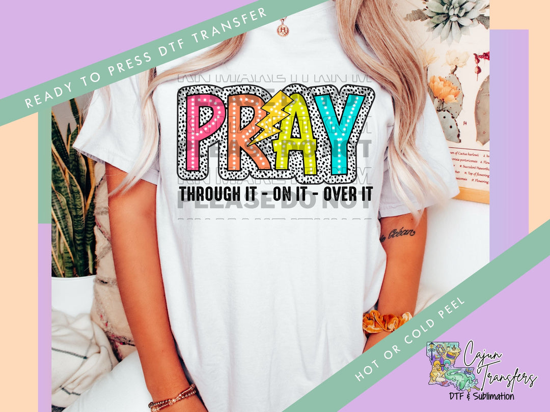 a woman wearing a t - shirt that says pray through one - on - one