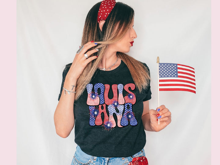 a woman holding a flag and a t - shirt