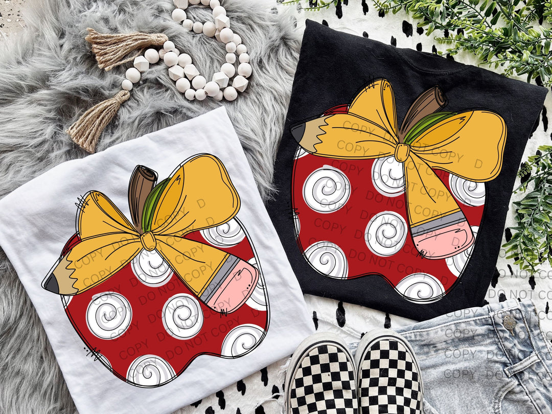 a pair of tshirts with apples on them