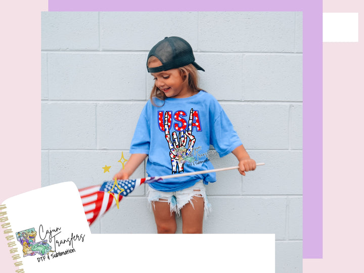 a young girl holding an american flag and a book