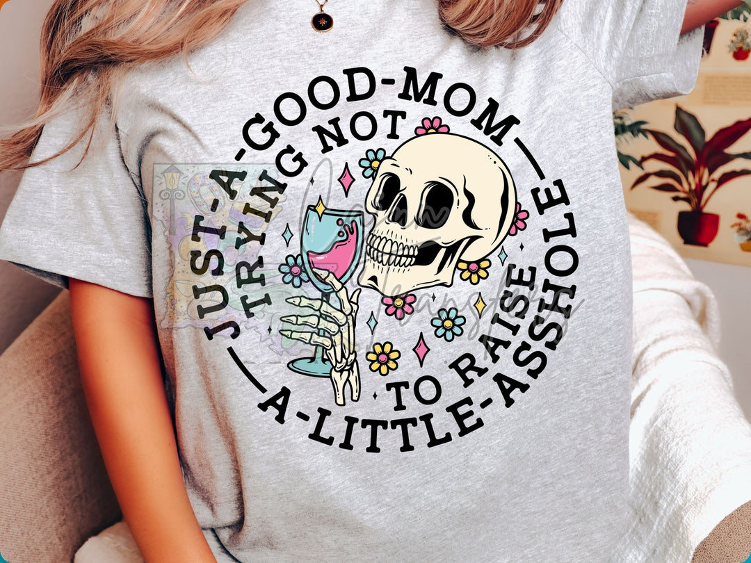 a woman wearing a t - shirt with a skeleton holding a glass of wine