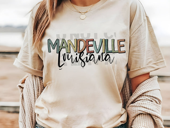 a woman wearing a t - shirt that says mandeville cuisine