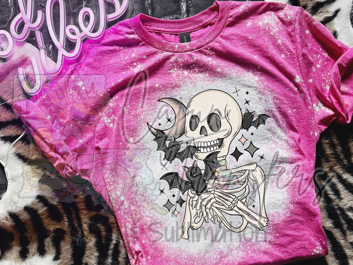 a pink shirt with a skeleton on it