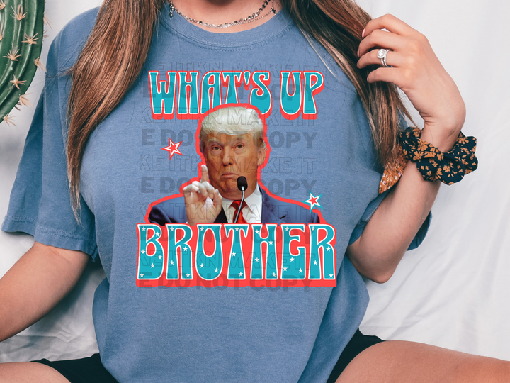 a woman wearing a t - shirt that says what's up brother