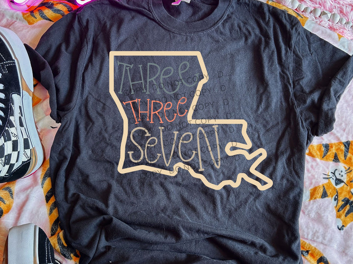 a t - shirt that says three three seven on it