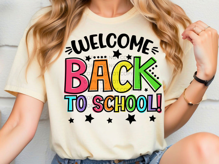 a woman wearing a t - shirt that says welcome back to school