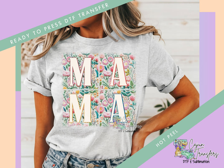 a woman wearing a t - shirt with the words mama printed on it