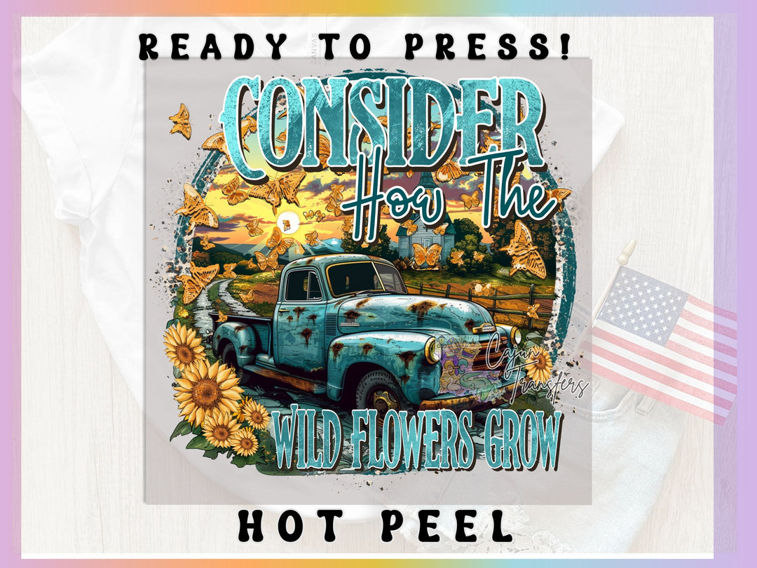 a blue truck with sunflowers and a rainbow background