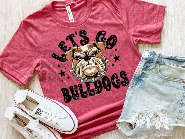 a shirt that says let's go bulldogs next to a pair of shorts