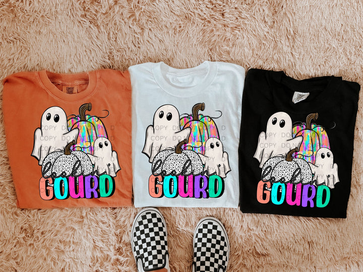 a couple of shirts that are on a carpet