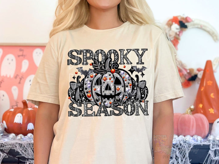 a woman wearing a spooky season t - shirt
